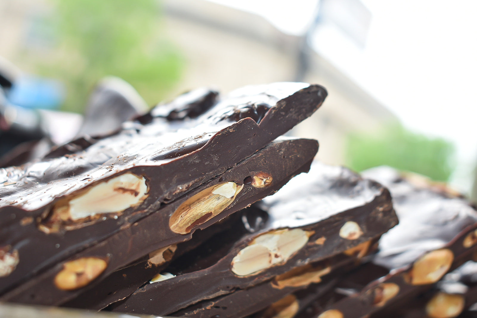 Chocolate Covered Almonds on Pink Paper